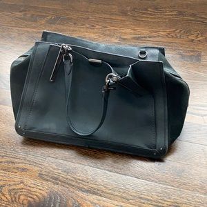 Coach leather and suede green tote with many pockets. Very good condition